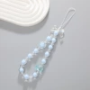 Blue beaded bracelet, mobile phone