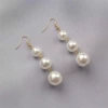 Step by step high -rise pearl ear hook