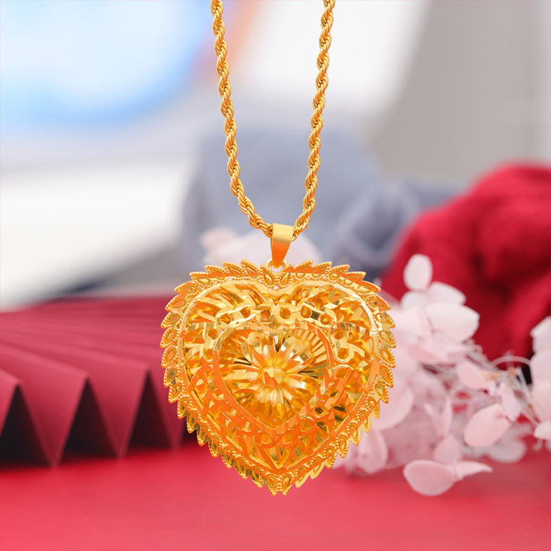 Nuevo melocotón corazón hueco flor COLLAR COLGANTE imitación de oro romántico en forma de corazón colgante de las mujeres de arena accesorios de oro retro todo partido