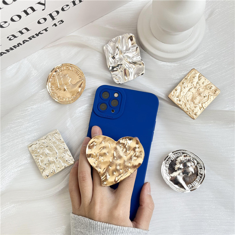 Retro estilo frío metal airbag soporte perezoso soporte de escritorio pegatina retráctil plegable cojín de aire soporte del teléfono móvil