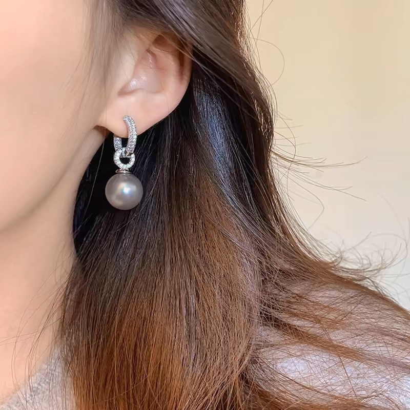 Small design elegant earrings with zircon from pearl with tassels