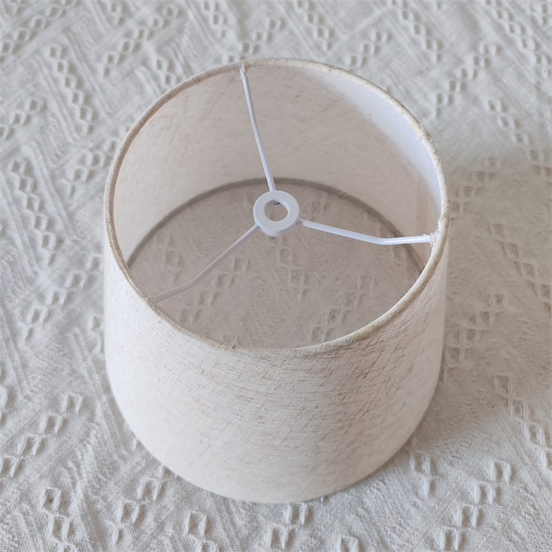 Amazon estilo americano pequeño redondo de hierro vaca esquina soporte lámpara de mesa accesorios pantalla cubierta de la cáscara redonda de lino sombreado de tela