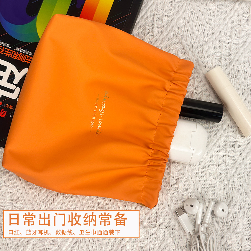 Nuevo impermeable pu bolsa de cosméticos lápiz labial de las mujeres sanitaria servilleta metralla bolsa de almacenamiento portátil cable de datos auriculares bolsa de almacenamiento