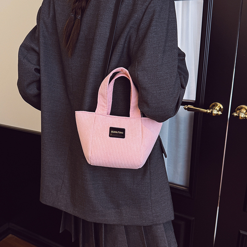 2025 otoño y invierno nuevo tipo de bolsas de balde de niños de lana de gran capacidad bolsas de hombro de moda coreana bolsas de tela para niños de vellón