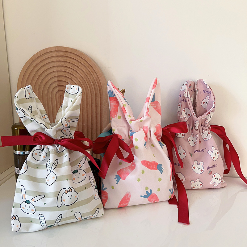 可爱兔子束口手拎袋女学生休闲手提收纳包遛弯零钱包杂物钥匙小包
