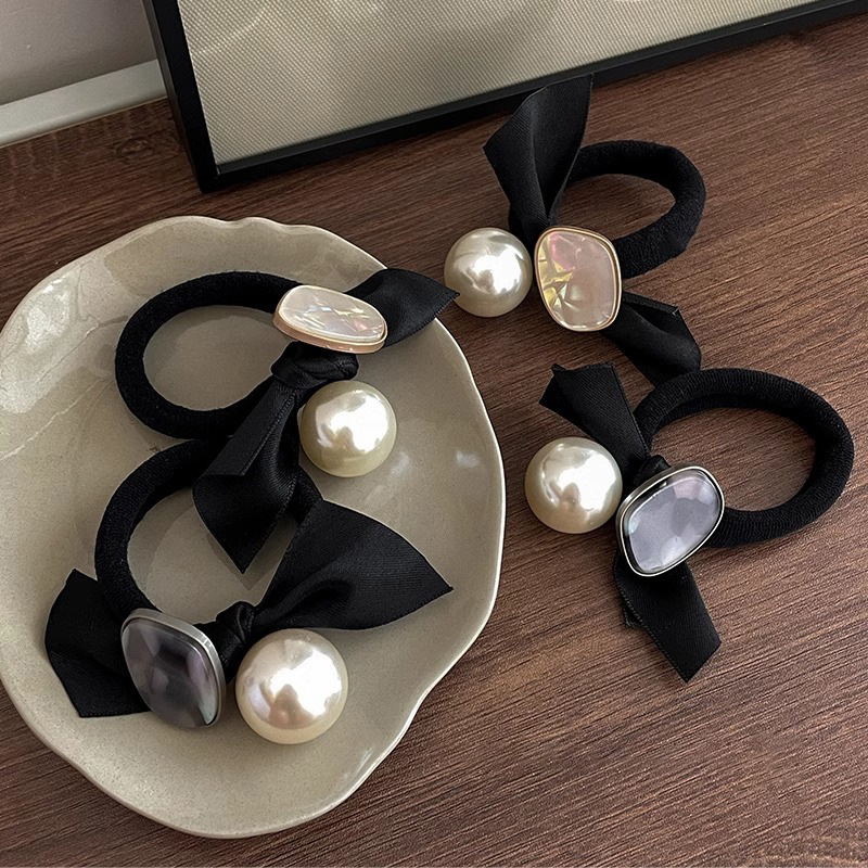 Arco negro coreano anillo de cabello de perla banda elástica de alta elasticidad para mujeres 2025 nuevos adornos de cabello de cabello de cuerda de cabeza