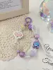 Three-dimensional beads on bow, purple, mobile phone clip, another shot