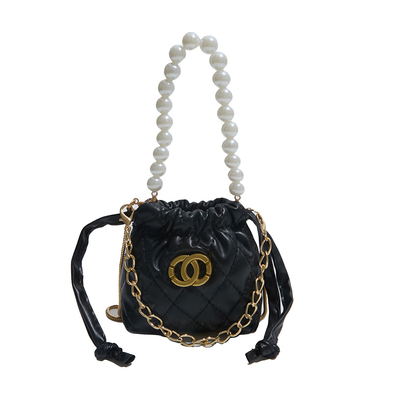 2026 nuevo niño cadena de perlas bolsos de diamante chicas moda mini bolsos de hombro caramelo princesa mochila