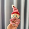 Pink striped button sweater + red and white pointed hat
