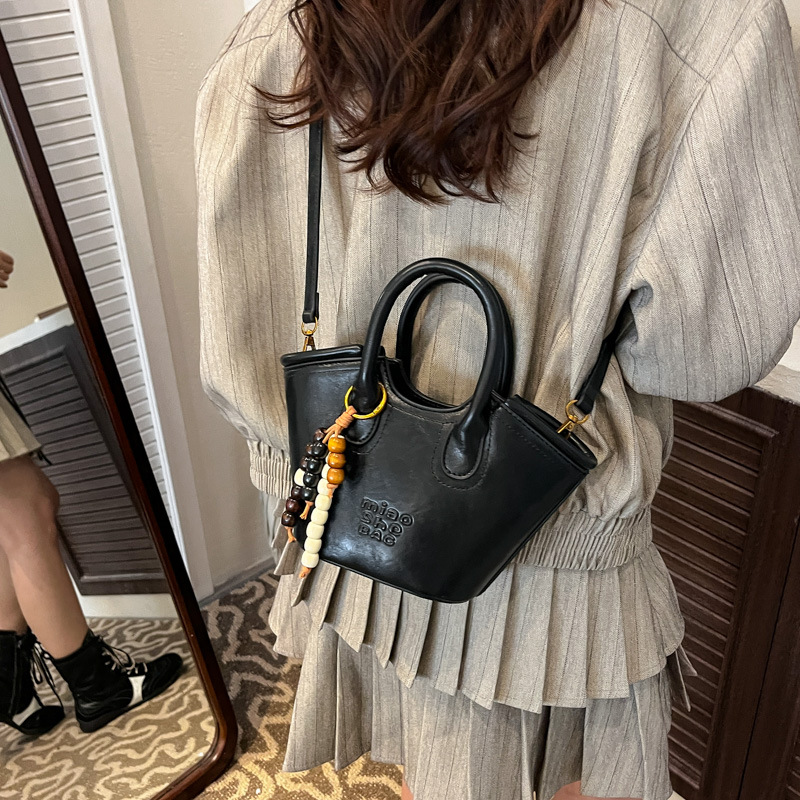 Bolsa de aire coreana para mujeres 2025, otoño y invierno, nuevo estilo de alta calidad, bolso de cubo portátil, bolso de hombro para viajar.