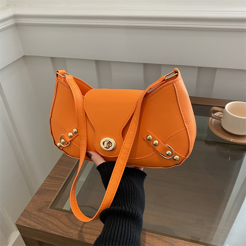 Bolsa de bolinillos retro chica caliente un hombro bolso de mochila para mujeres 2025 nuevo diseño locomotora de cierre de viento bolso de brazo