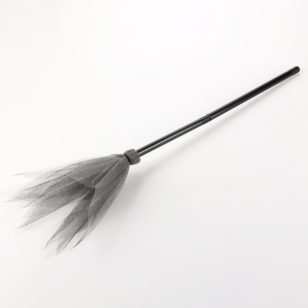 Gray and black hard mesh broom.