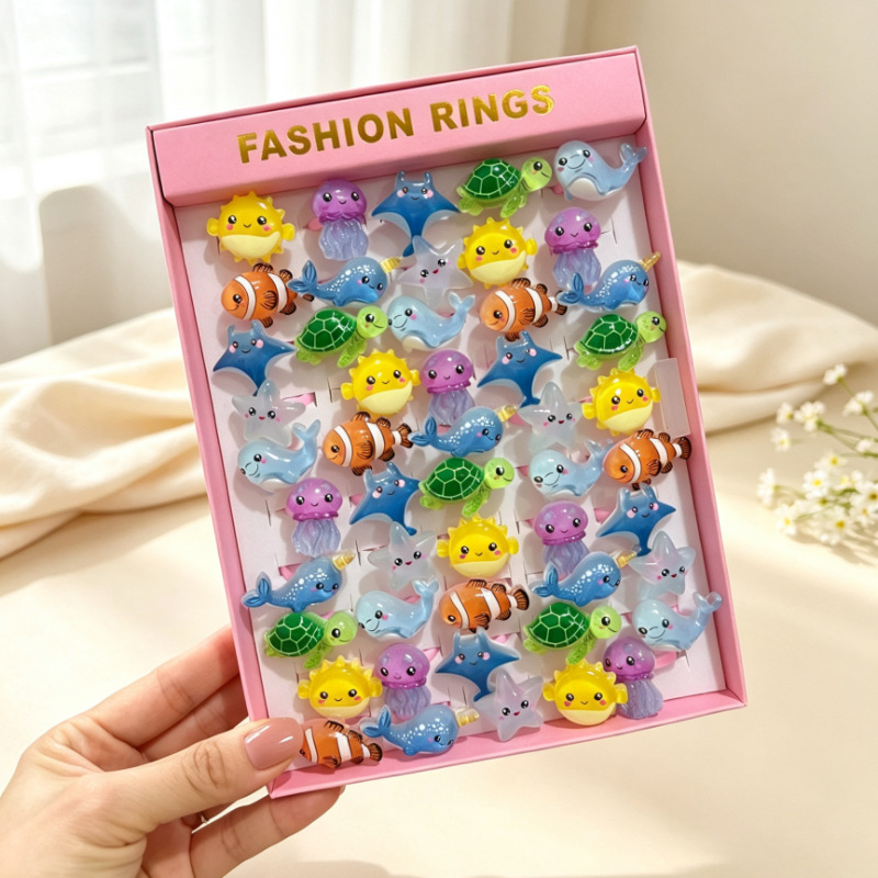 Anillo de flores de dibujos animados para niños transfronterizos 50 anillos de plástico esmerilado abierto en caja regalo de cumpleaños jardín de infantes