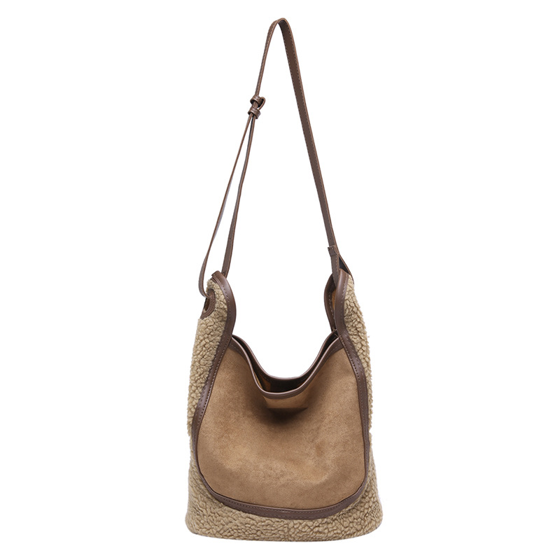 Retro tela esmerizada bolso de cubo de agua mujer 2025 nuevo nicho de moda cordero gran capacidad mochila de hombro