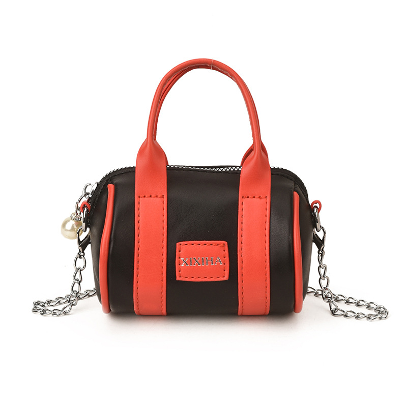 Bolsa de almohada cilíndrica de moda de contraste para niños y niñas bolsas de cadena mini lindas para bebés 2026 nuevas bolsas de accesorios para niños