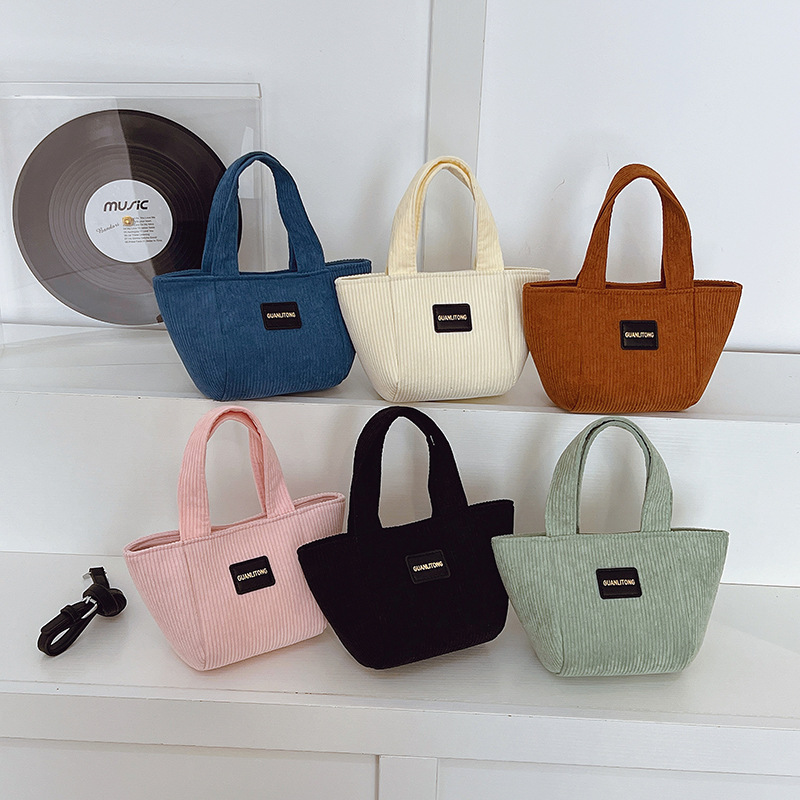 2025 otoño y invierno nuevo tipo de bolsas de balde de niños de lana de gran capacidad bolsas de hombro de moda coreana bolsas de tela para niños de vellón