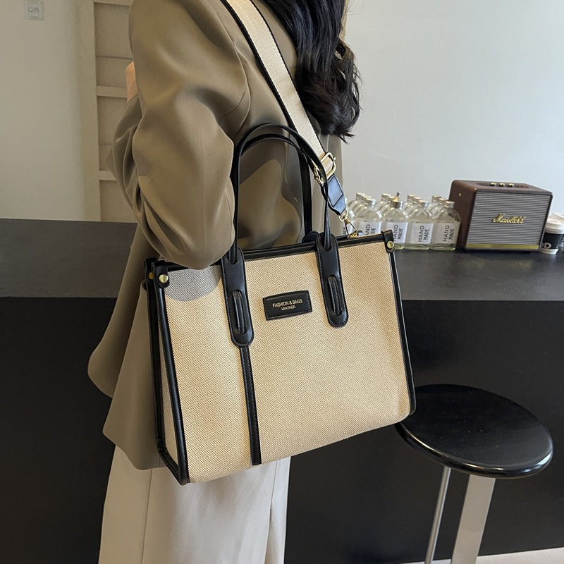 Bolsa de lona de gran capacidad para mujeres 2024 nuevo estilo sensación de moda mochila de hombro para viajar bolso de mano universal