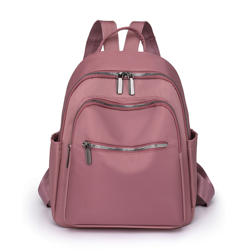 2023 nueva mochila de tela Oxford de color sólido para mujer, arte urbano, viajero, mochila de viaje ligera, mochila escolar al por mayor