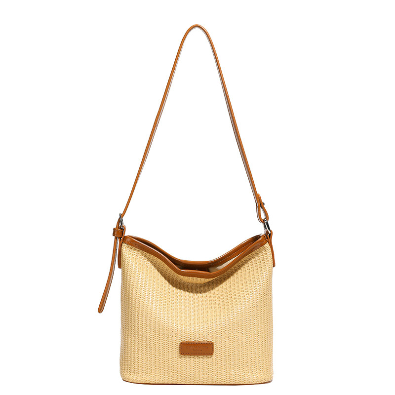 Verano nuevo estilo 2025 commuter vacaciones viento cubo bolso de hombro de estilo occidental de moda femenina bolso de mensajero de alta gama de nicho