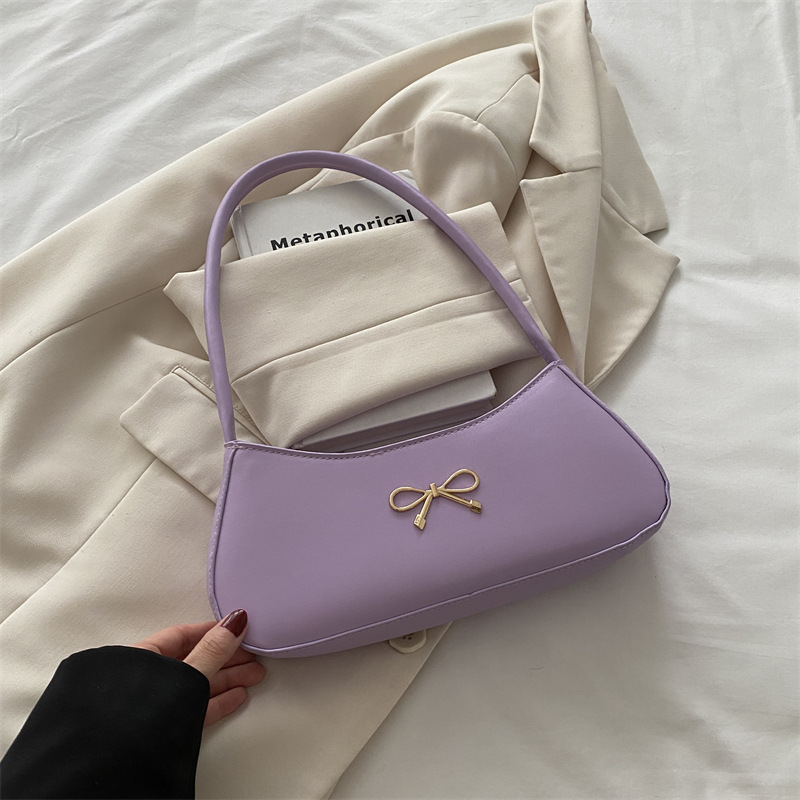 Bolso de axila con lazo para mujer 2025 nuevo bolso de bola de masa de lujo simple y ligero de alta calidad textura bolso de mensajero de un solo hombro marea