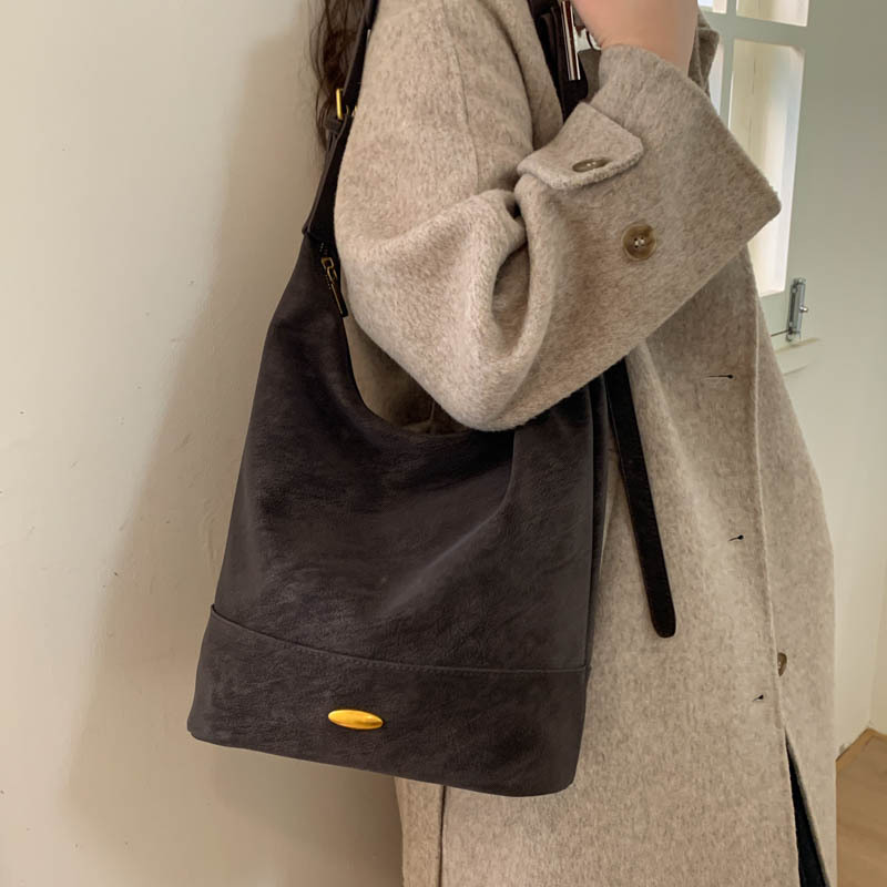 Coreano relajado sensación de colapsar bolso de cubo de seda bolso de mujer 2025 nuevo retro bolso de hombro bolso de viaje