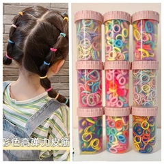 子供のキャンディー色のタオルリングのカラーボックスに100本の皮筋の頭飾りの女性が髪を巻いている少女は髪を傷つけない