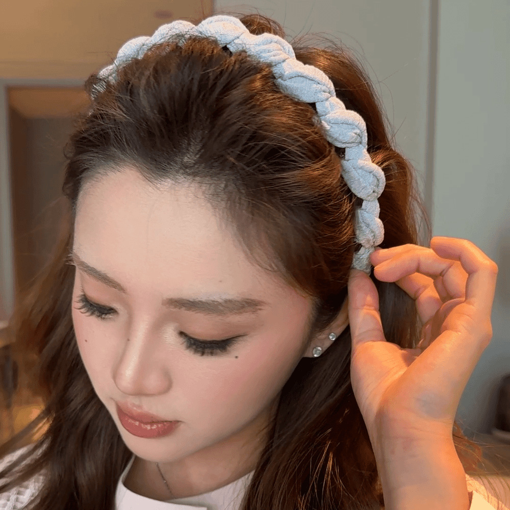 A gray-blue twisted tooth comb headband