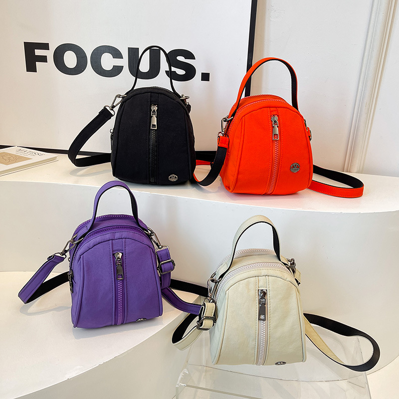 Coreano simple color sólido bolso de hombro para niños y niñas bolso de mochila deportivo casual para bebés 2025 nuevo tipo de bolso de conchas para niños
