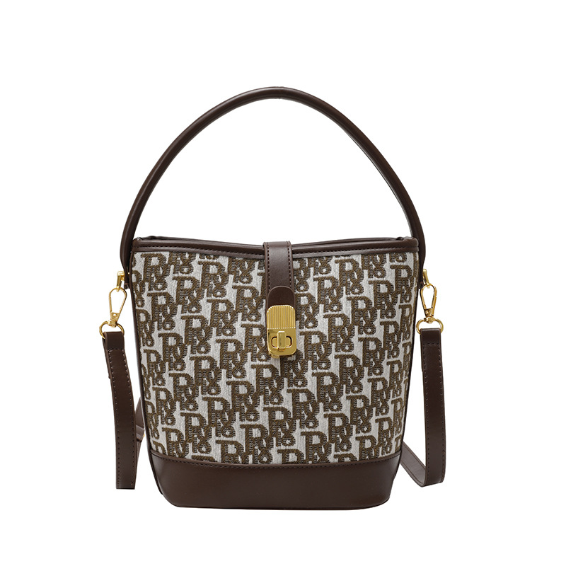 Bolso de mano exquisito de alta gama para mujer 2025 nuevo bolso de cubo retro con estampado de tela bolsa de mensajero de un solo hombro de nicho