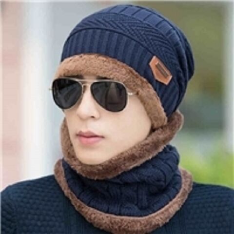 New winter knitted woolen hat with fur lining and thickening for warmth. New striped knitted hat for cold protection when riding a bike. 