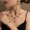 E2116-3 three-piece set with golden green flowers