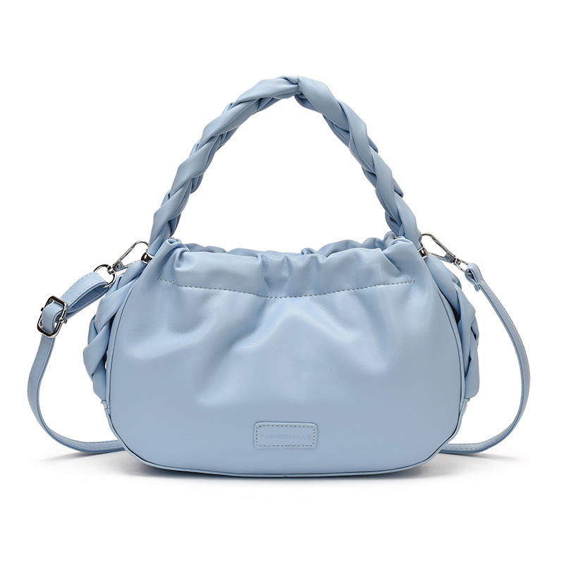 Corea del Sur nueva bolsa de mano plegada mujer 2026 primavera nicho versátil bolso de mochila simple de moda bolsa de nube de viaje