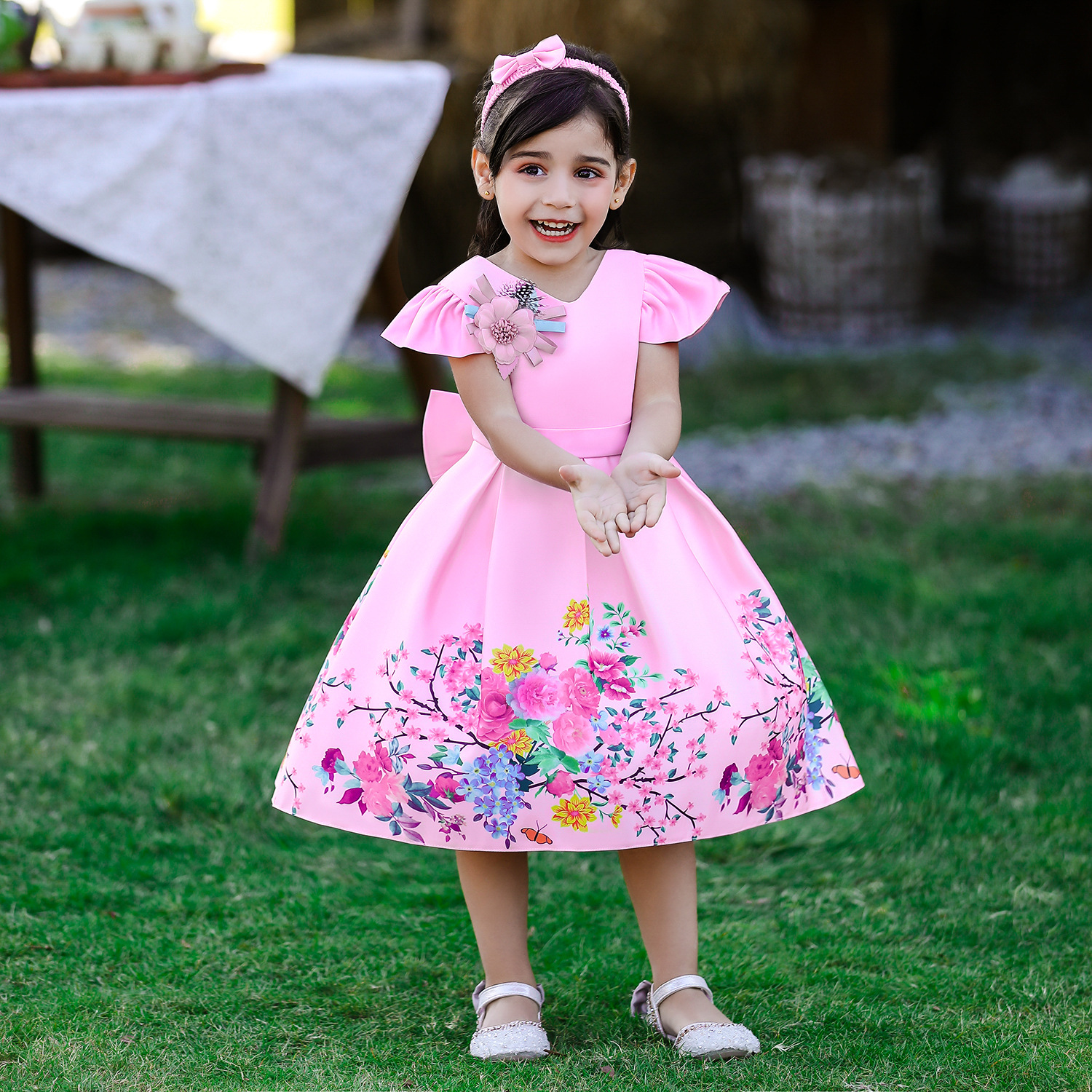 Nuevo vestido de los niños europeos y americanos impreso tela forjada arco bebé niña cumpleaños princesa vestido origen suministro