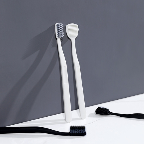 New black and white spiral bristle toothbrush tongue coating combination anti-slip brush handle adult household soft bristle toothbrush manufacturer wholesale