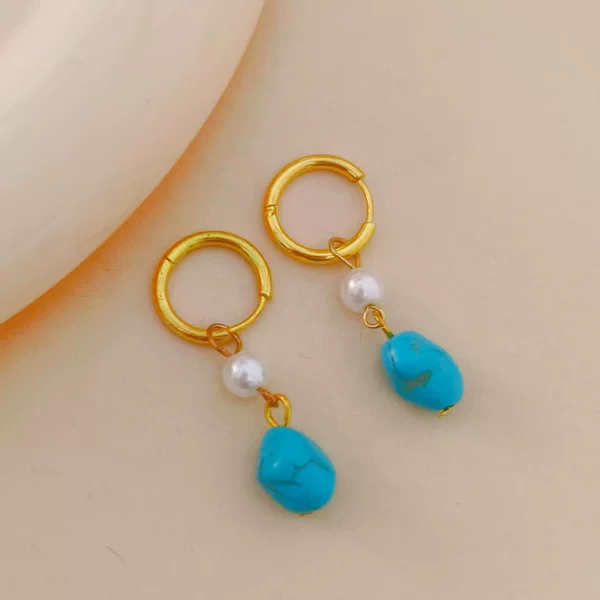 European and American style asymmetrical blue turquoise earrings, featuring small, cultured pearls, exuding a sophisticated and fashionable aura