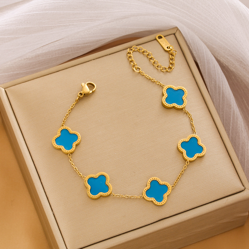 Pulsera de trébol de acero titanium vendedora caliente transfronteriza europea y americana con incrustaciones de concha pulsera colgante pulsera de diseño avanzado sin desvanecimiento al por mayor