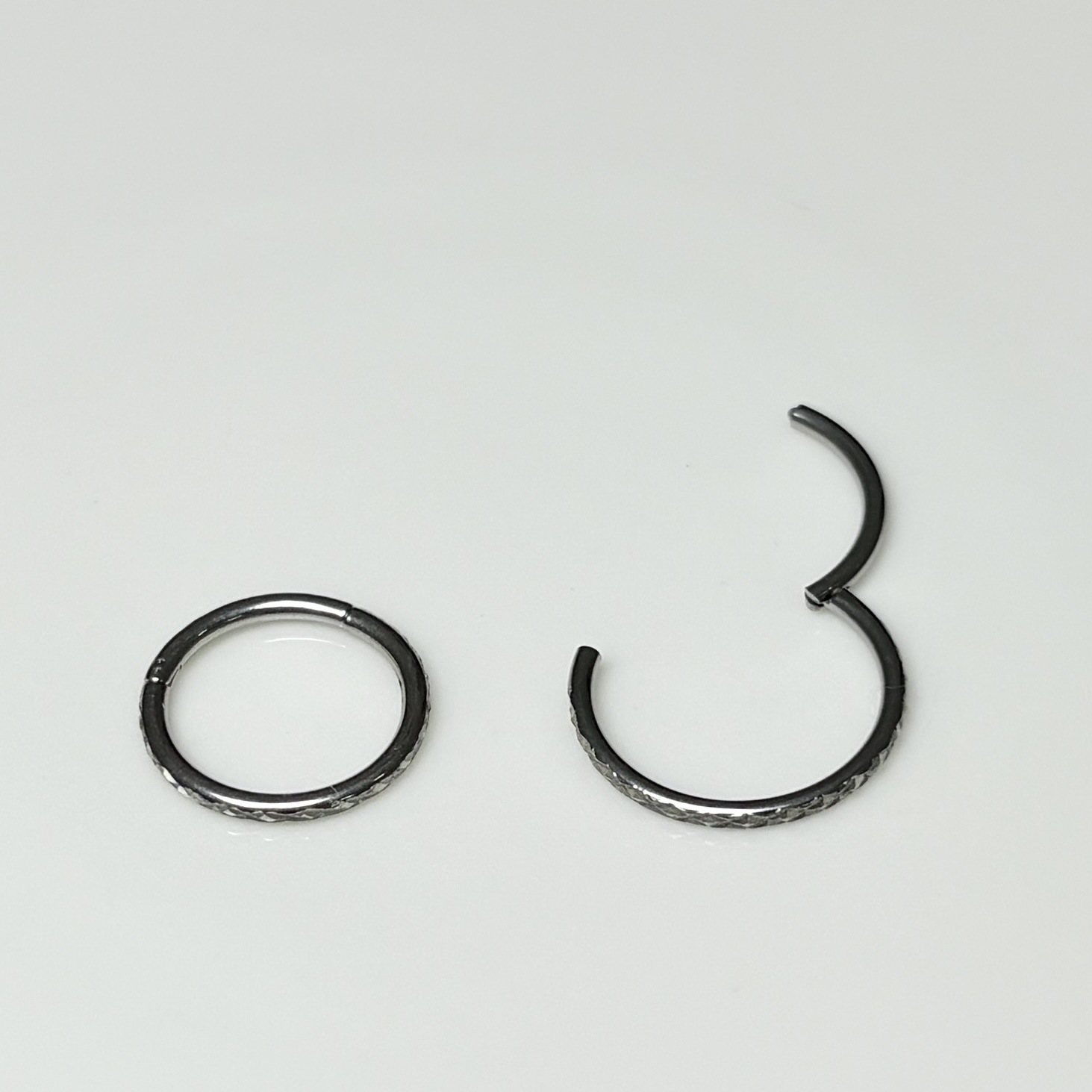 Silver pointed spike labret stud material detail