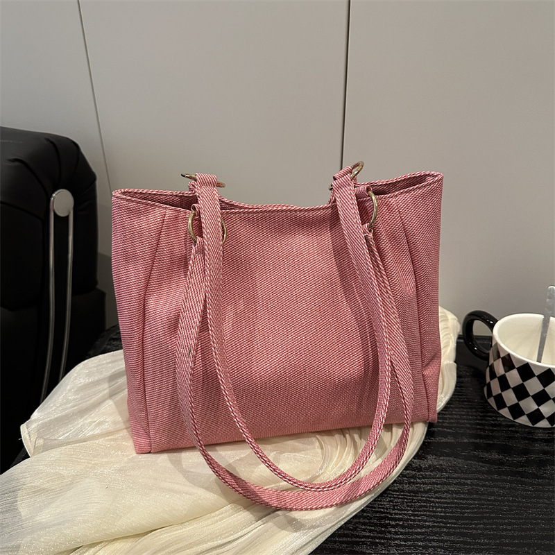 Bolsa de textura para mujeres de gran capacidad 2025 nueva primavera y verano ocio rayas bolsas de compras de hombro para clase de viaje bolsa
