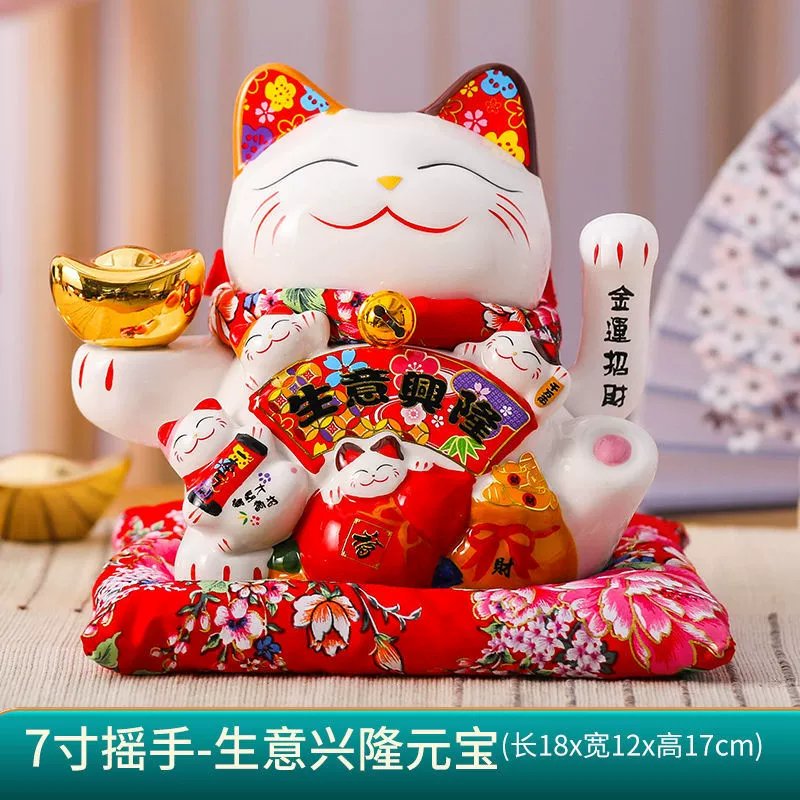 7 -inch wealth cat ornament shakes hands.