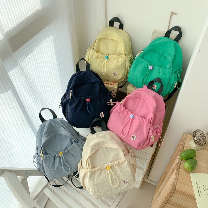 Coreana pequeña mochila fresca para niños y niñas, color macarón jardín de infantes, mochila para bebés, mochila de cuerda sólida para niños