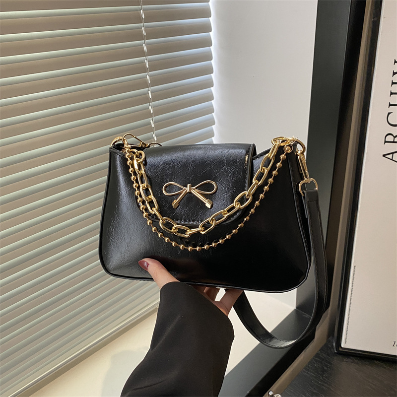 2025 nuevo estilo de color sólido tendencia primavera casual bowknot cadena de mujer axila de un solo hombro bandolera mujer