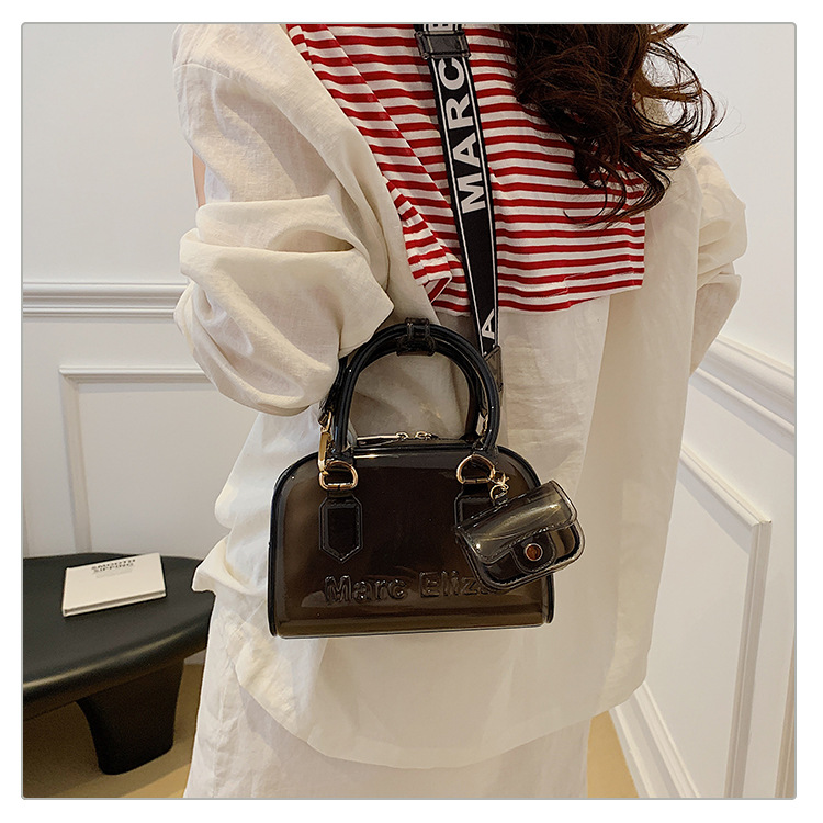 Verano nuevo bolso de almohada portátil de PVC transparente de jalea para mujeres este año popular alta textura mochila de hombro