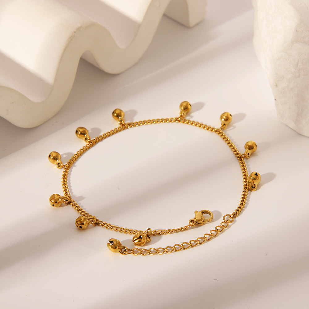 Estilo étnico transfronterizo europeo y americano, campana de nicho simple hecha a mano, tobillera, personalidad de moda femenina, adornos para pies de acero de titanio chapado en oro de 18K