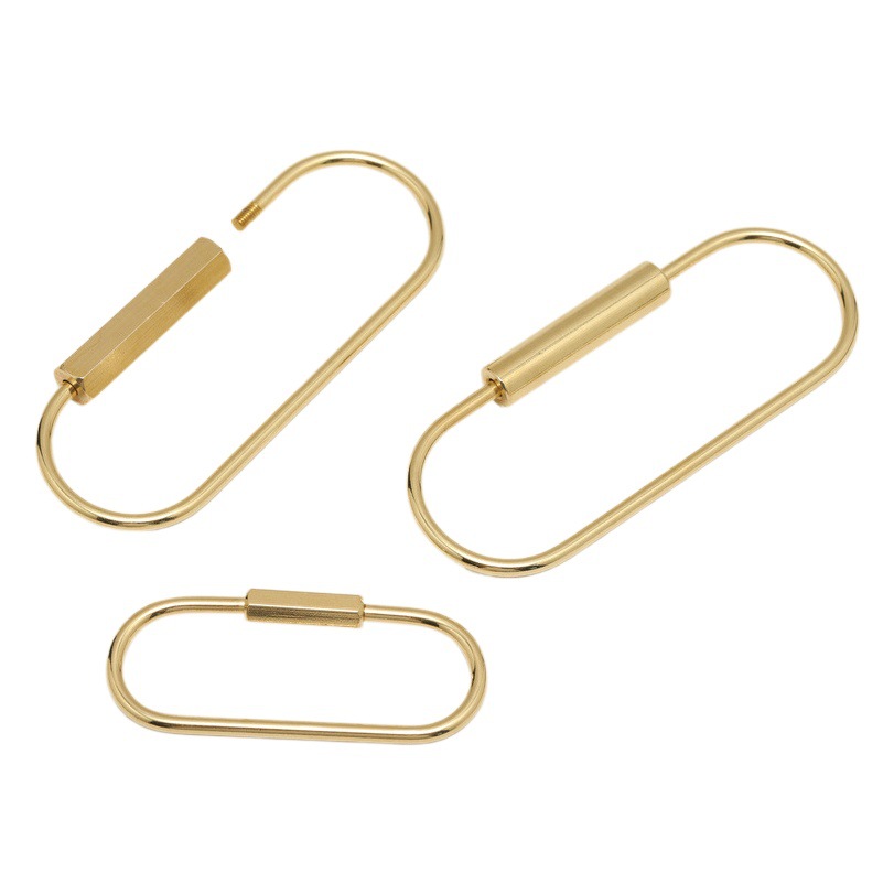 真鍮の楕円の北欧の簡単な線はねじを掛けて鍵を掛けます。