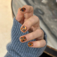 春夏の手描きの小さい花の短いタイプの純粋な手作りの豆の甲は甲の純粋な手を身につけて猫の目のネイルの完成品の甲の切れを作ります。