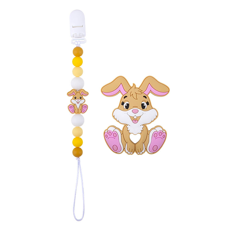 Amazon nuevo bebé suministros de dibujos animados conejo de silicona juguete mordedor pezón anti-gota cadena molar traje