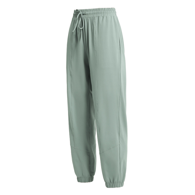 Pantalones deportivos europeos y americanos pantalones largos de protección solar para mujeres con cordón para adelgazar polainas sueltas Otoño e Invierno nuevos deportes más pantalones de Yoga de tamaño