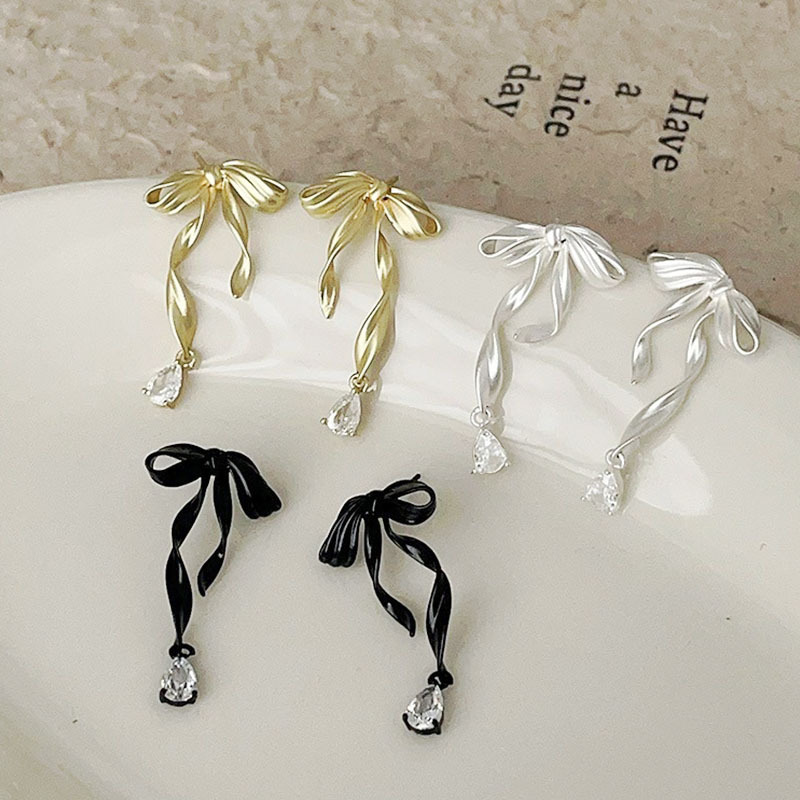 Cute elegant earrings with bow with zircon