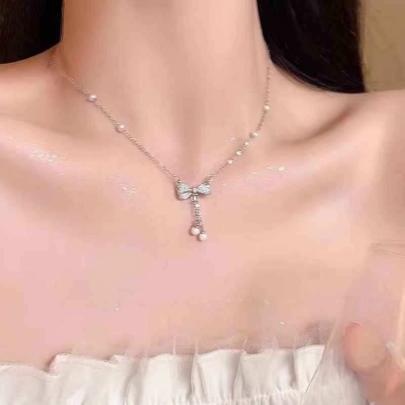 Fashionable elegant sophisticated necklace with bow pearl with…