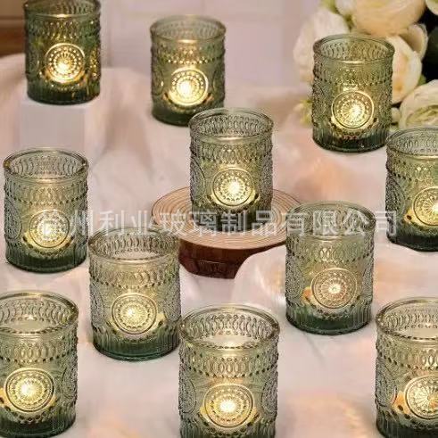 Amazon transfronterizo se especializa en candelabros de vidrio en relieve, juegos de candelabros de incienso de colores, tazas de velas a rayas, candelabros a rayas, estampados en Ling